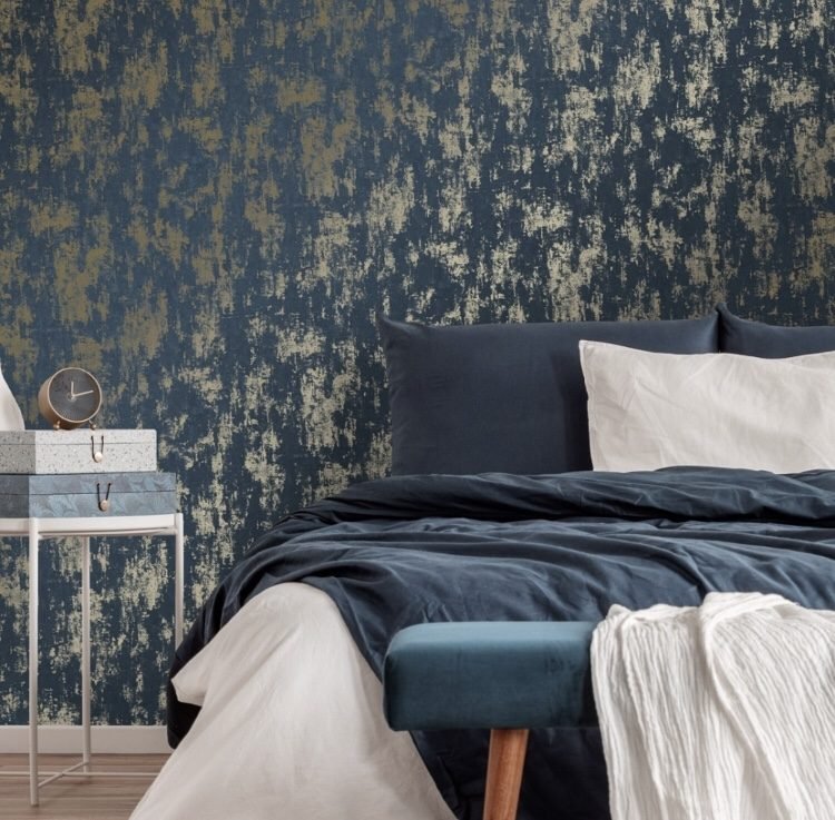 dark blue and gold wallpaper for a moody bue bedroom look