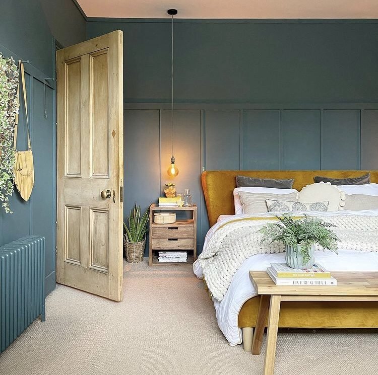 sea blue wall panelling in the bedroom for a boho look