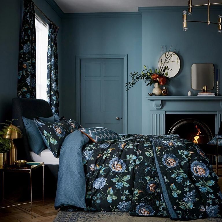 dark blue bedroom ideas - dark walls and blue floral bedding 