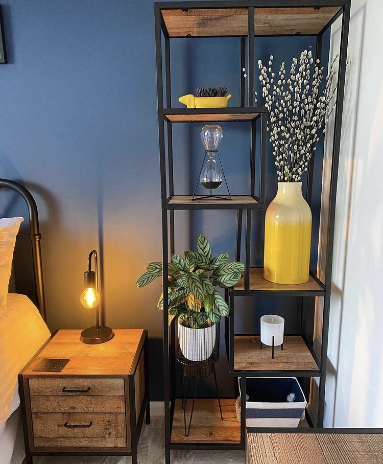 dark blue bedroom with industrial furniture 