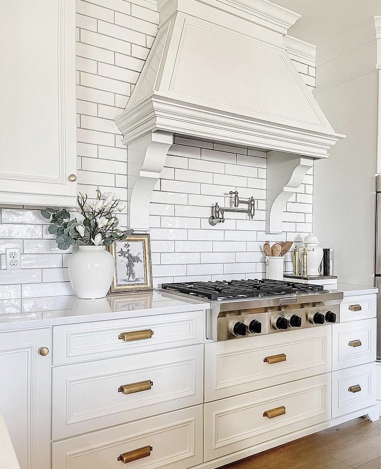 beautiful white and gold farmhouse kitchen