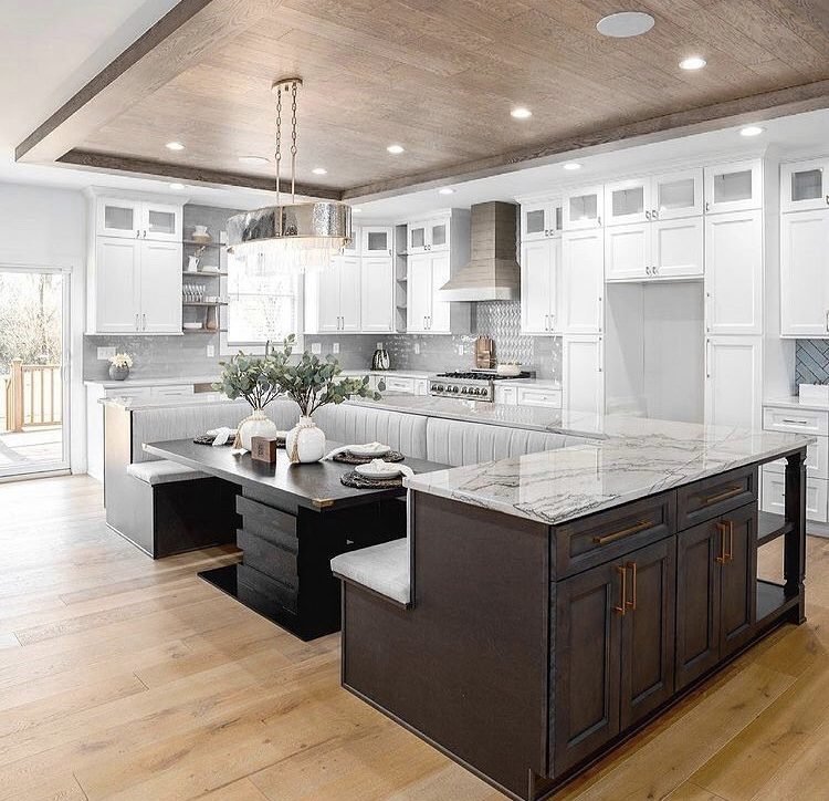 white and wood kitchen with island and banquette seating 