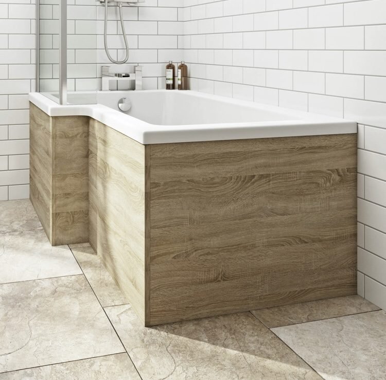 L shaped bath with oak wood panelling 