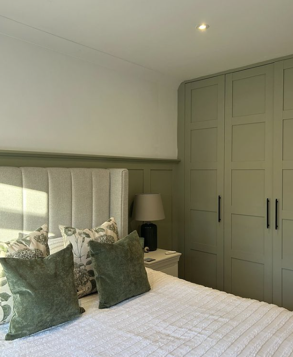 green-bedroom-panelling-with-wardrobes