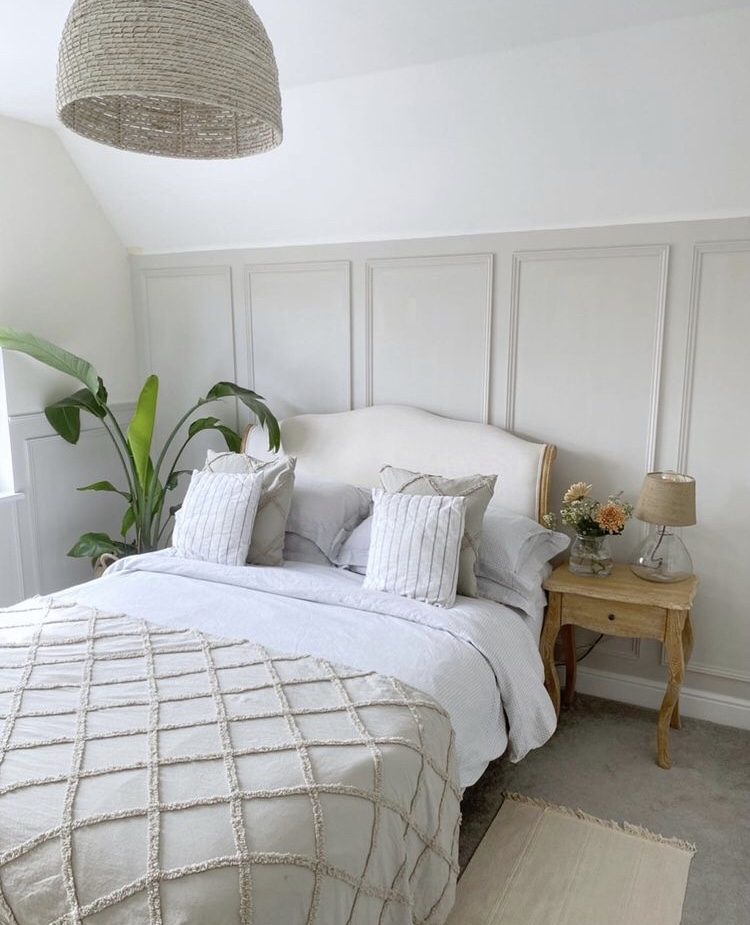Image of bohemian style bedroom with cream panelled walls
