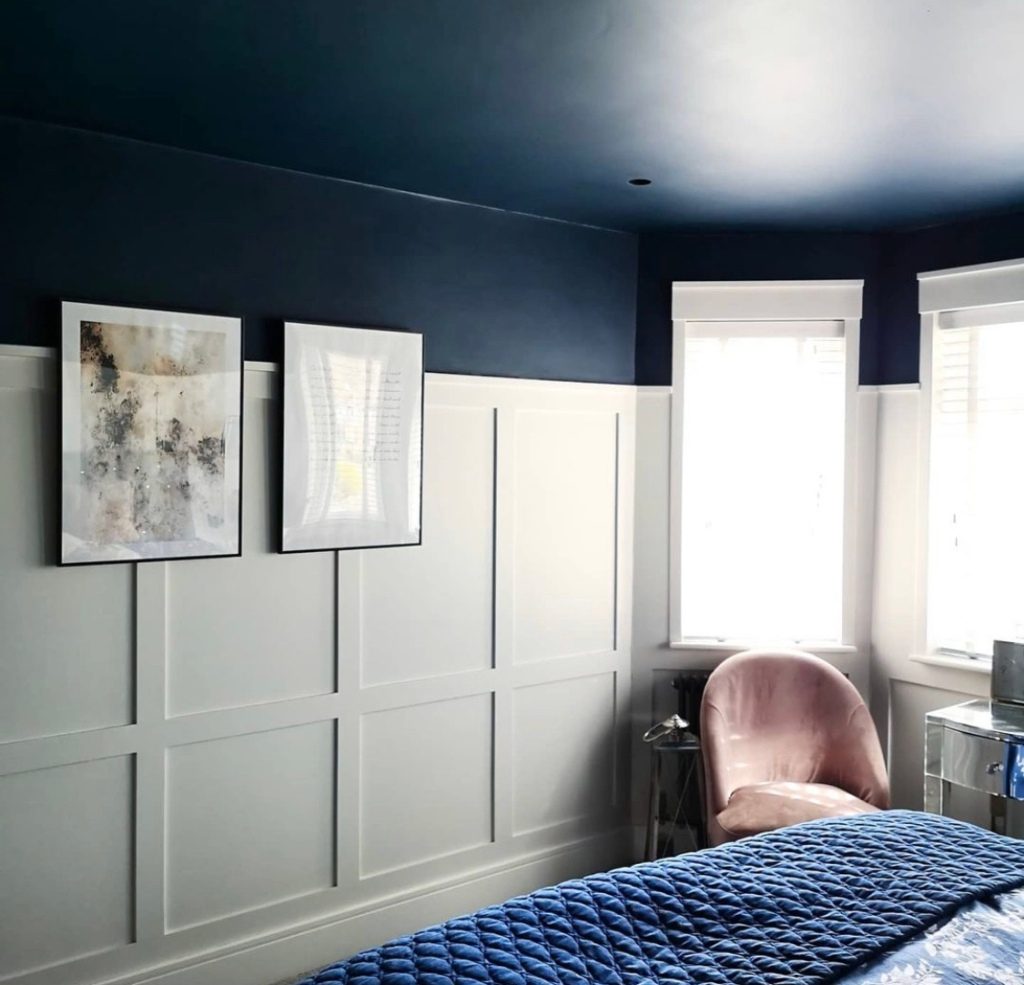 Grey bedroom with half wall panelling 