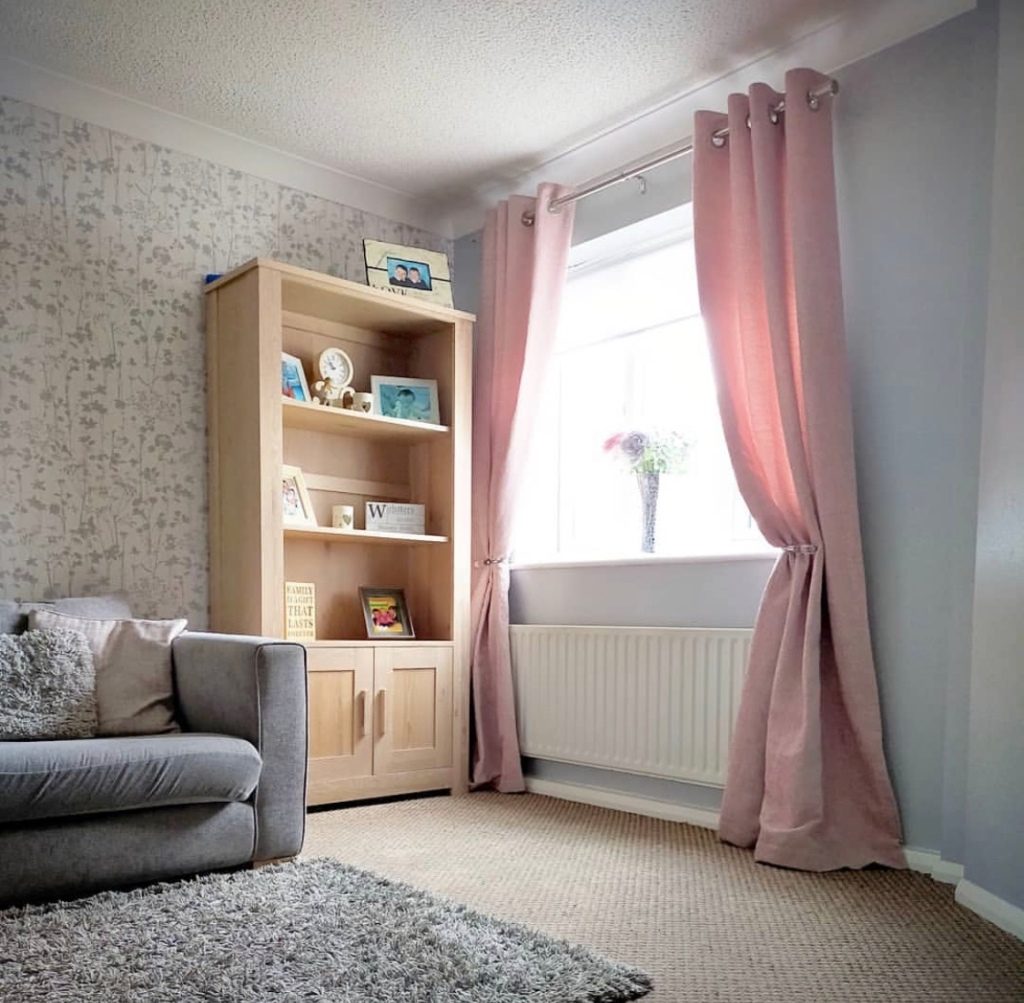 minimalist pink and grey living room idea with pink curtains