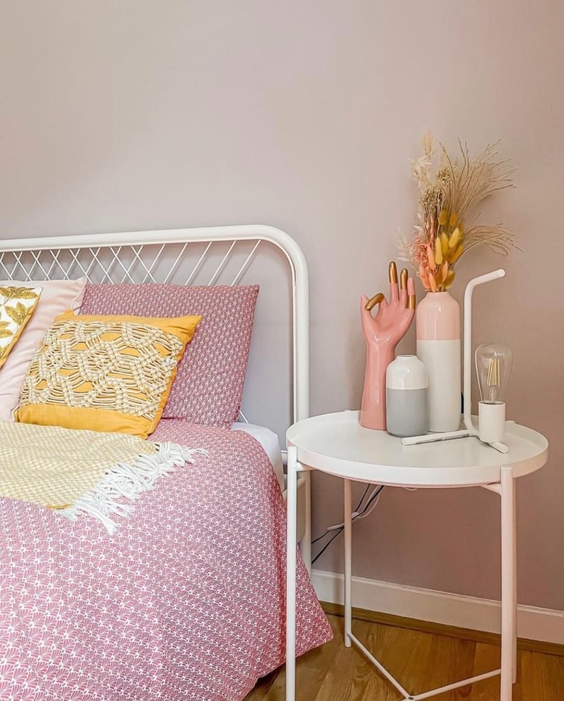 Soften your grey bedroom by including pastel decor