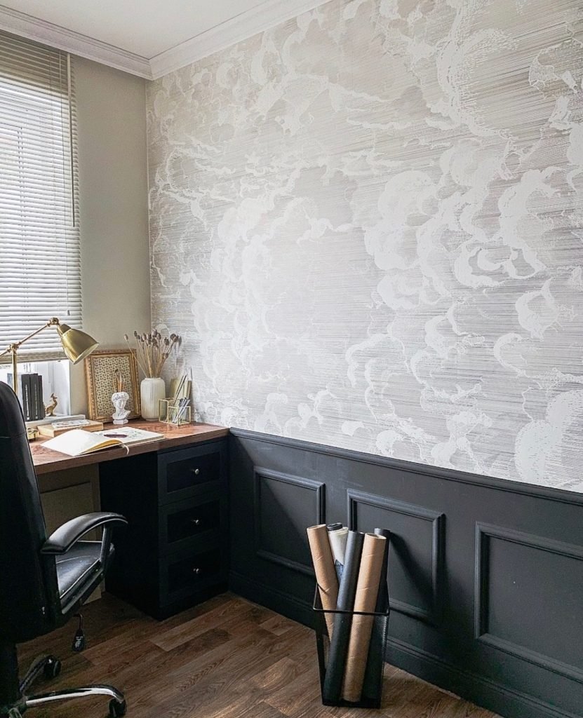 dark grey home office with half wall panelling and floral wallpaper 