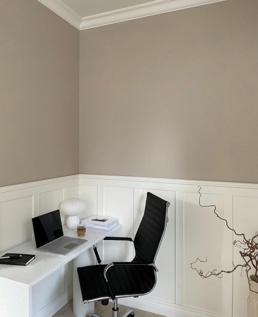 beige and white home office with half wall panelling 