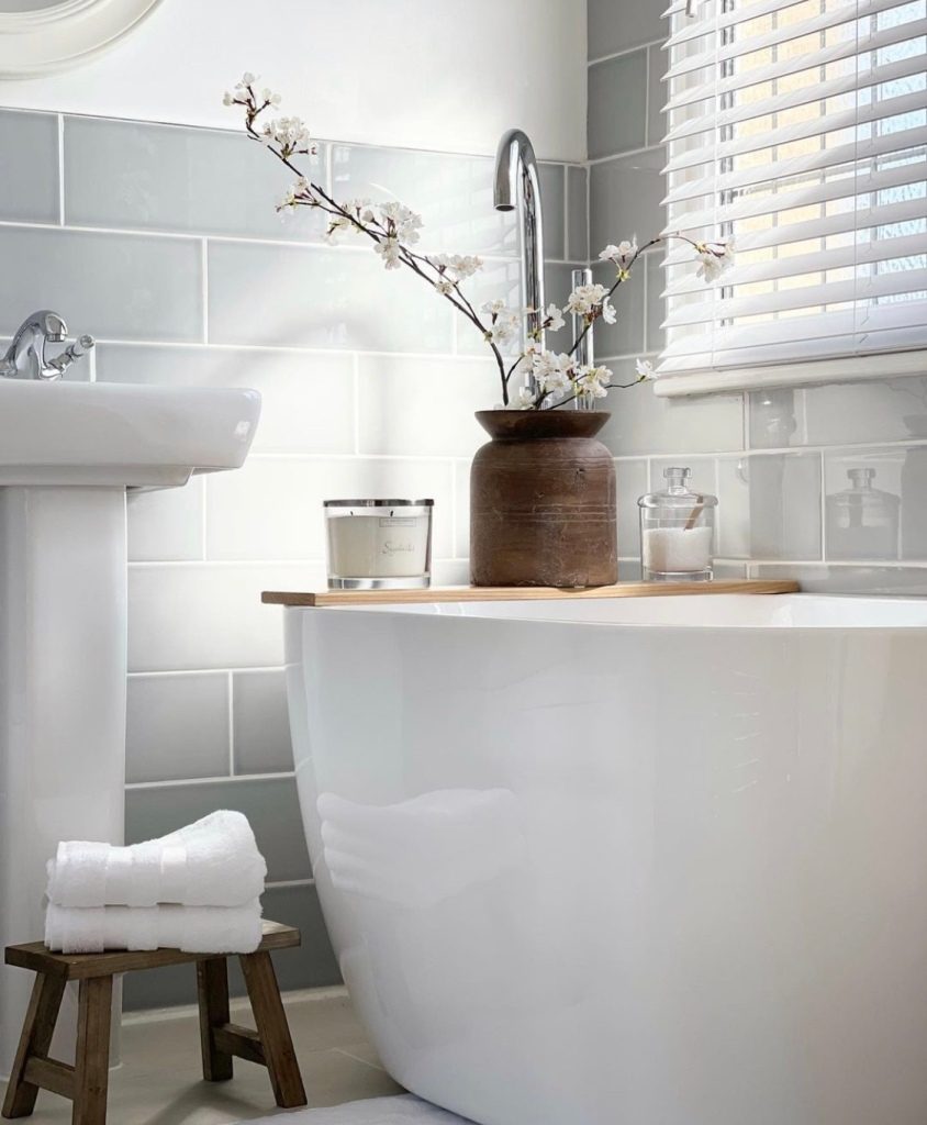 Serene white bathroom idea with tub 