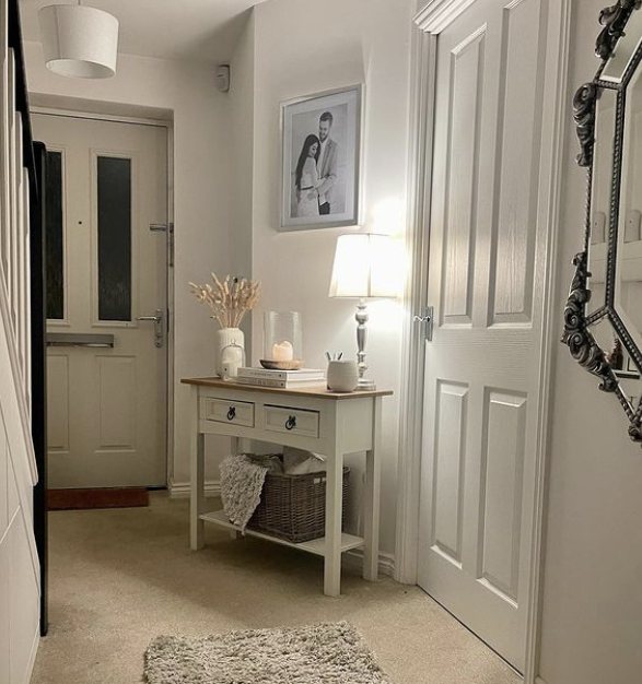 hallway console table ideas - white console table in a neutral hallway