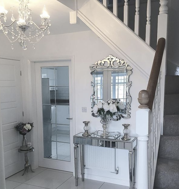 hallway console table ideas - white hallway with reflective table