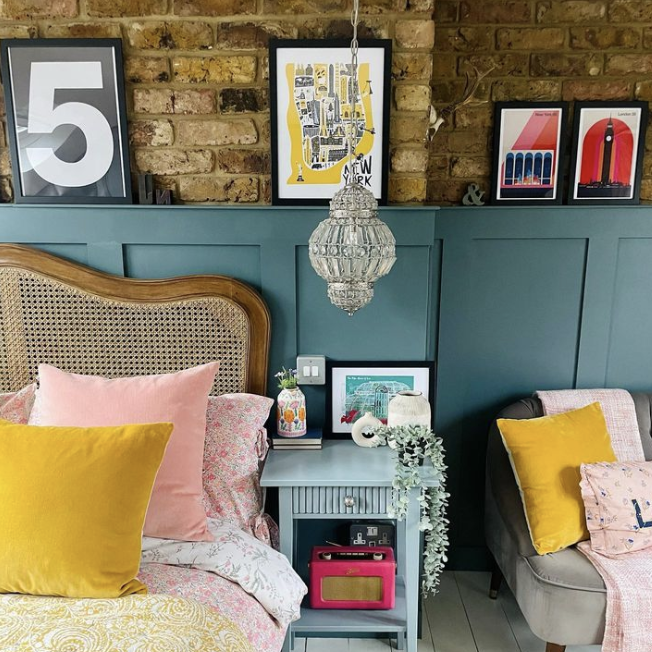 how to add eclectic decor to your home - colourful bedroom with brick wall feature