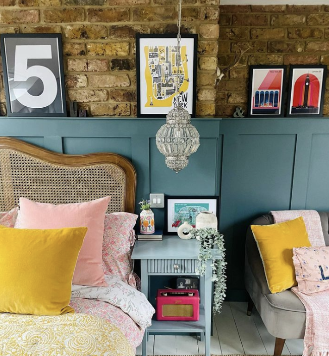 how to add eclectic decor to your home - colourful bedroom with brick wall feature