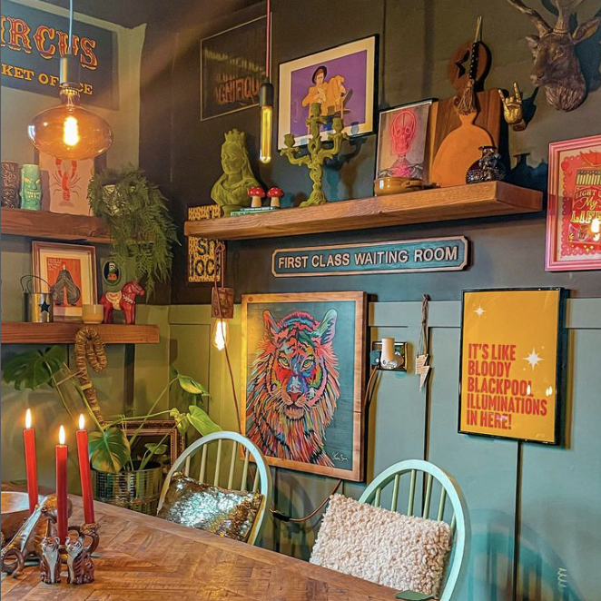 how to add eclectic decor to your home - dining room with bright and colourful gallery wall