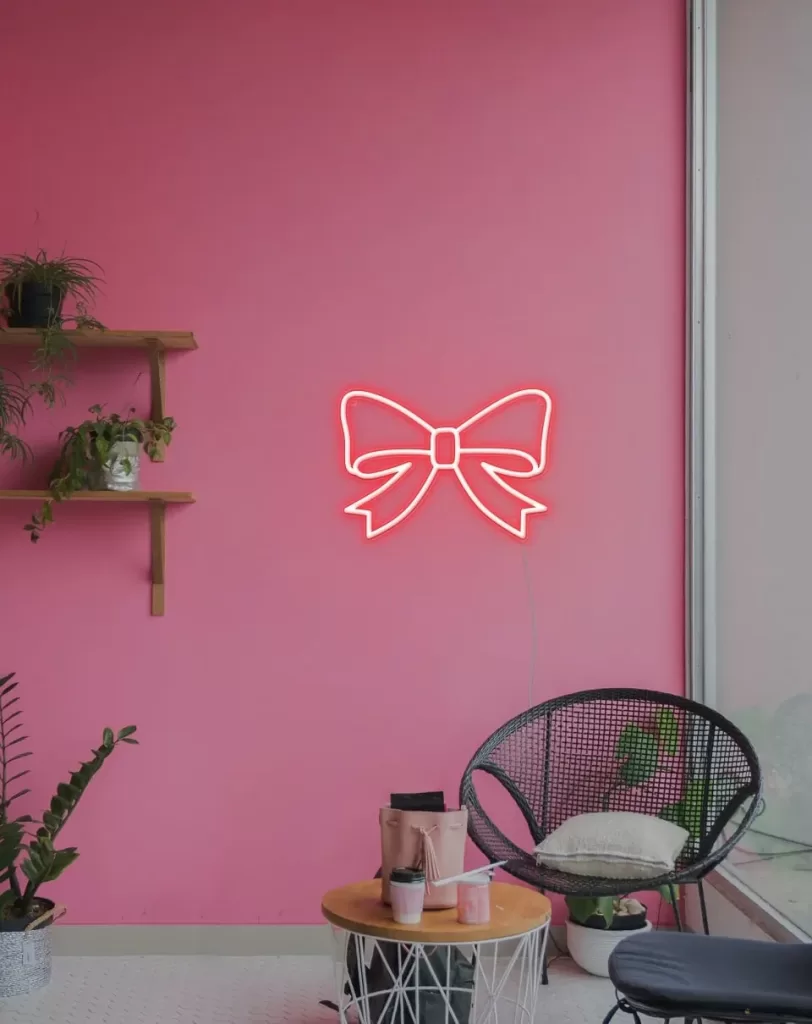 red neon sign - red bow neon sign
