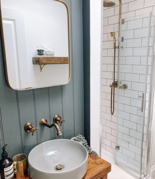 blue panelling in a bathroom with shower