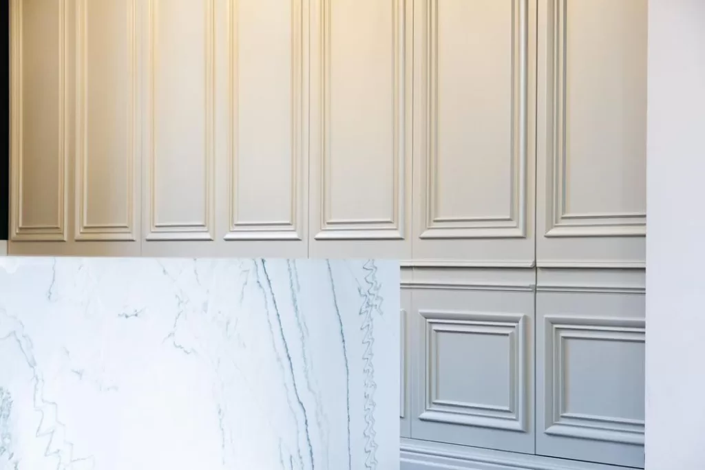 hidden kitchen ideas - white pannelled cabinets