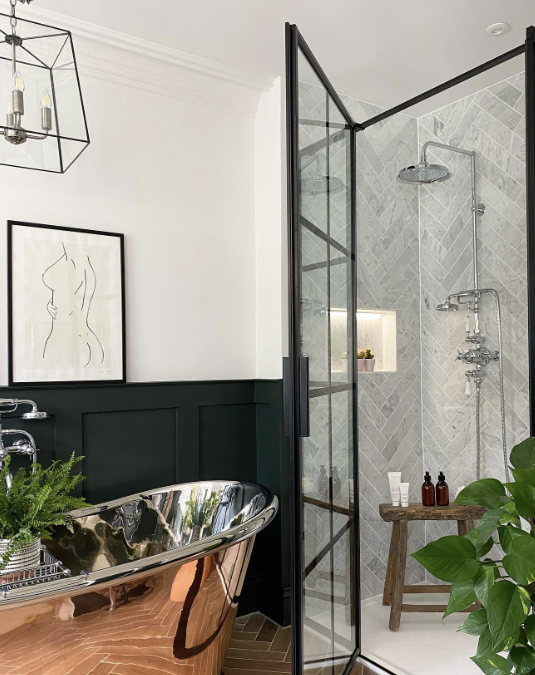 modern bathroom with panelling stainless steel tub and panelled glass shower
