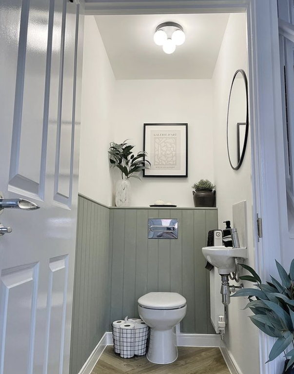 sage green panelling in a downstairs toilet