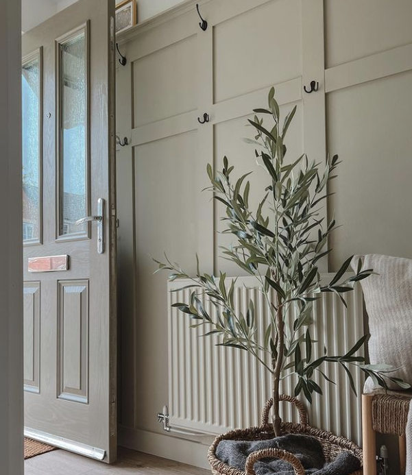 sage green panelling in a hallway