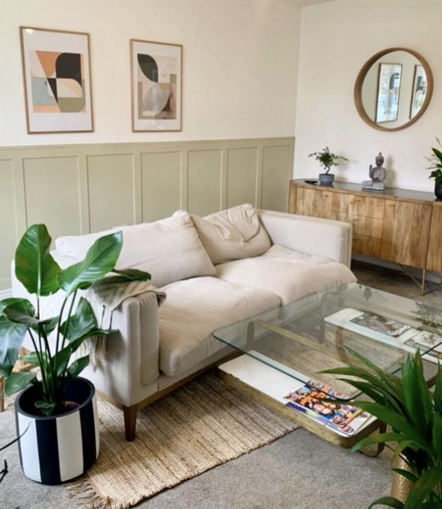 Sage green living room wall panelling