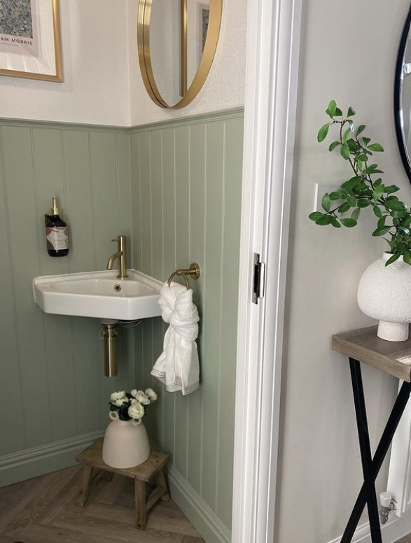sage green panelling in the toilet