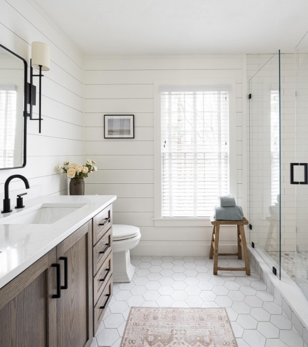 white shiplap panelling in an open bathroom with modern furnishings