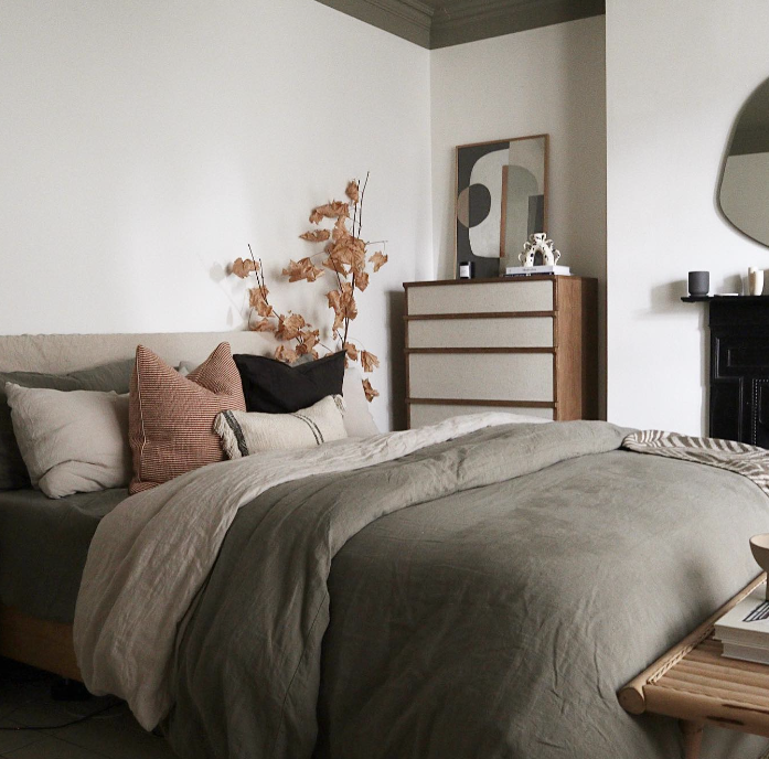 Japandi style bedroom with soft muted tones of green and brown