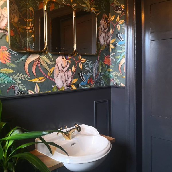 blue downstairs bathroom with jungle wallpaper - quirky downstairs toilet ideas
