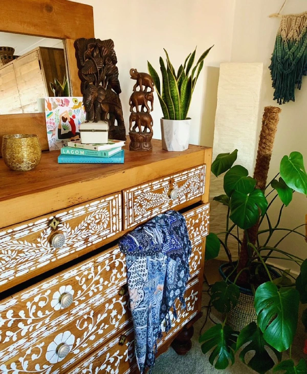 eclectic decor with quirky chest of drawers and memorbillia from around the world