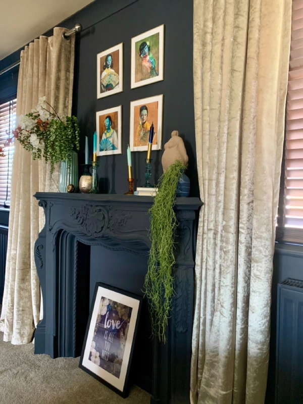 eclectic vintage bedroom with painted fireplace