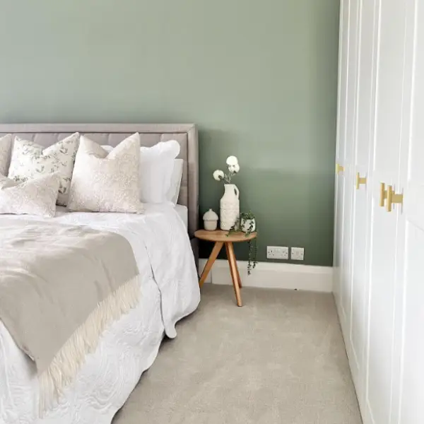 sage green bedroom with grey bedding - green colour trends for 2023