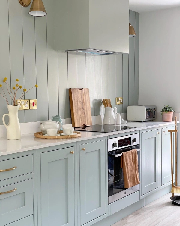 wall panelling in ktichen - slat panelling in a kitchen with blue shaker style fitted kitchen