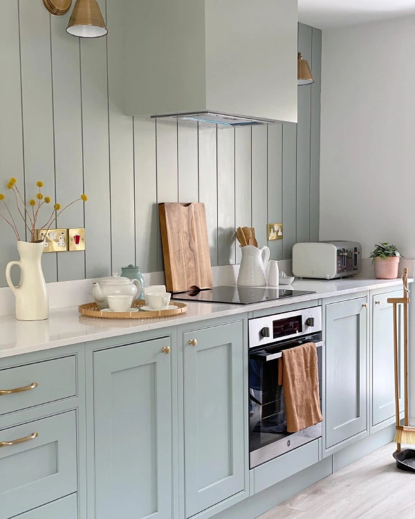 slat panelling in a kitchen with blue shaker style fitted kitchen