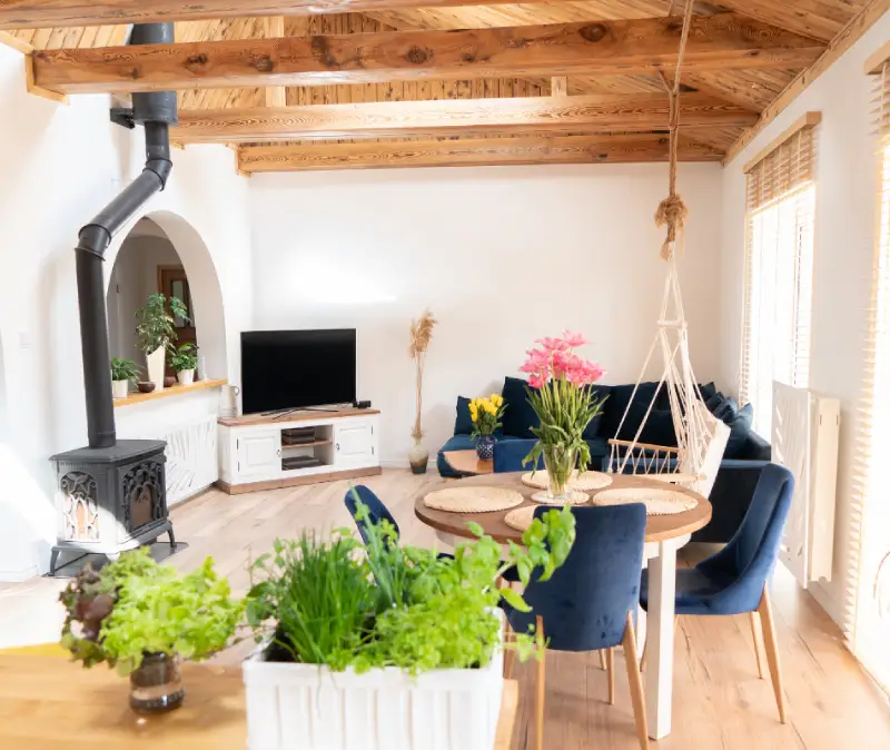 boho living room with wooden beams and log burner