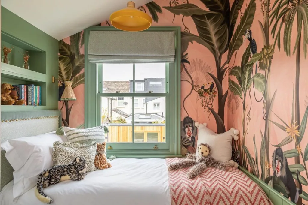 green and pink kids bedroom with jungle theme wallpaper