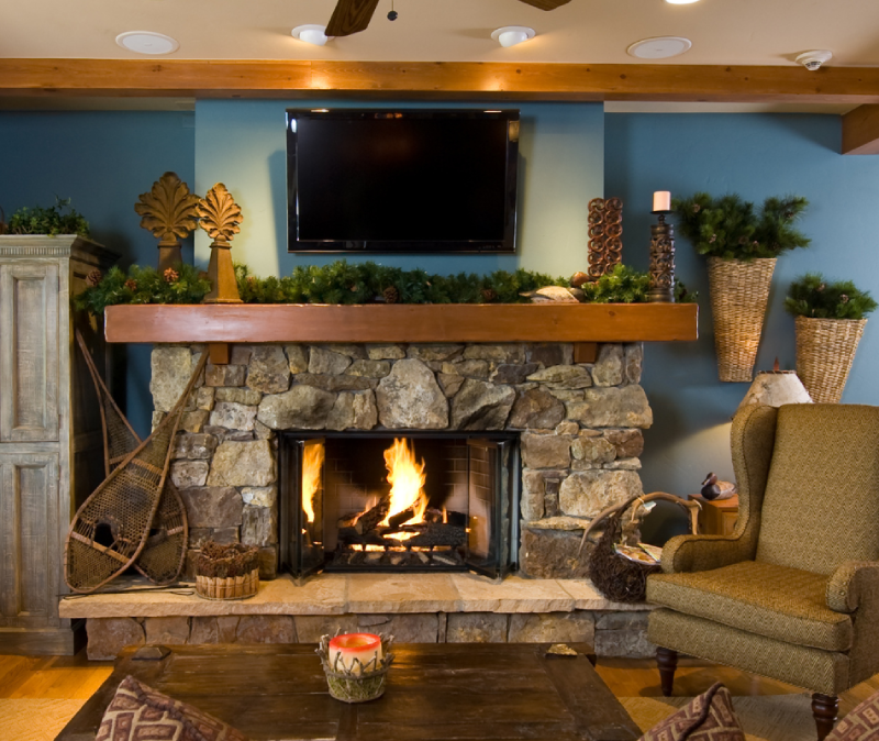 rustic fireplace brick wall with TV