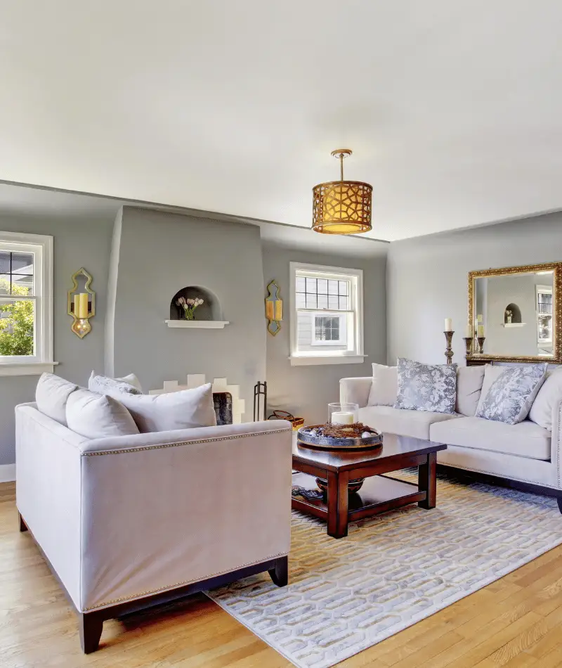 grey living room with statement lighting