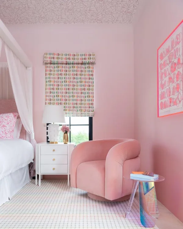 all pink bedroom with pink armchair