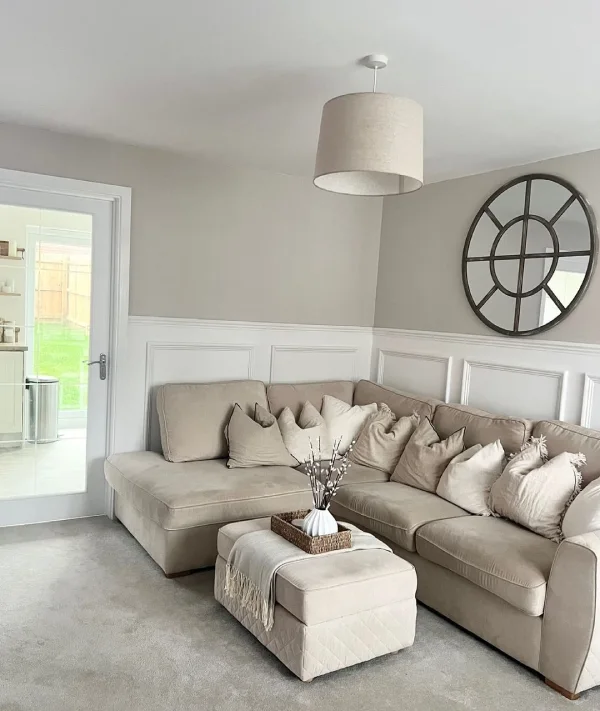 cream living room idea with cream sofa and walls and white panelling