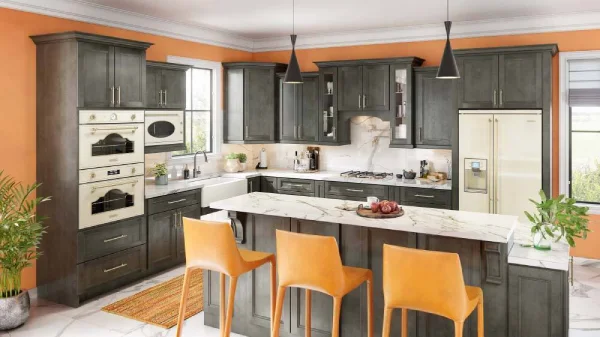 gray kitchen cabinets with white counter and spashback