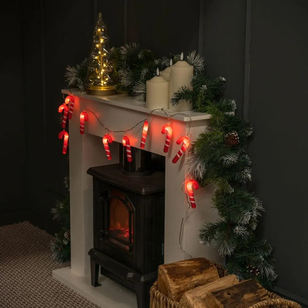 candy cane string lights around a fireplace