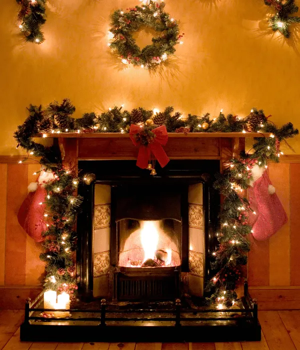 classic christmas garland around a fireplace