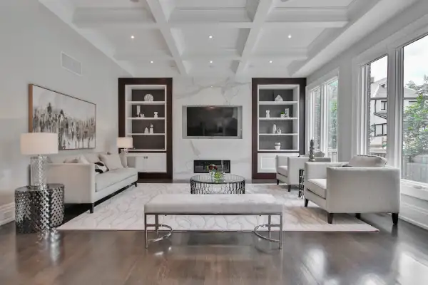 large white living room with modern furniture and panel ceiling