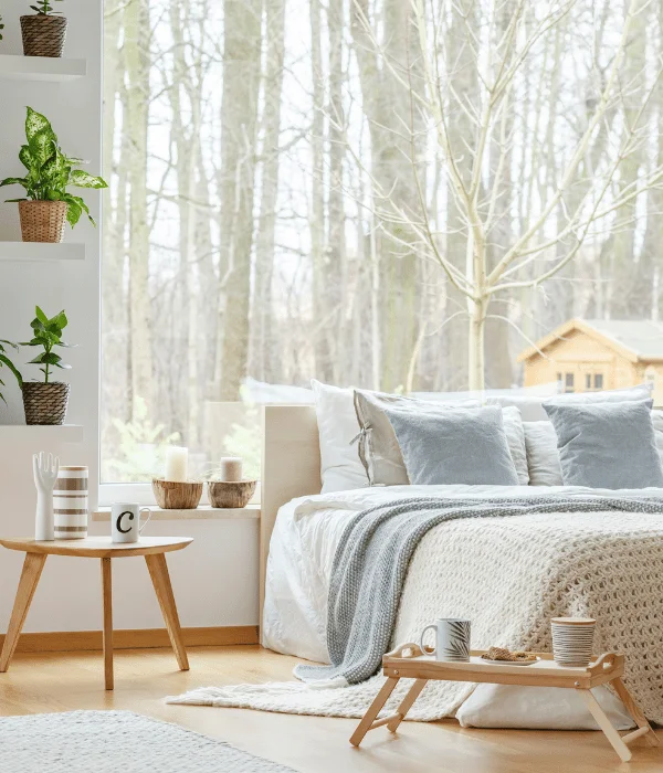 minimalist bedroom with woodland view