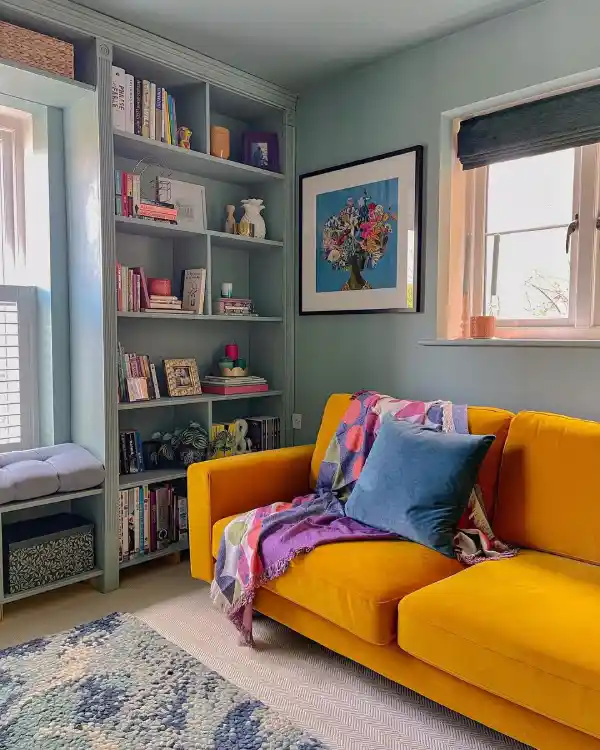 blue small living room layout with bookshelf and yellow sofa