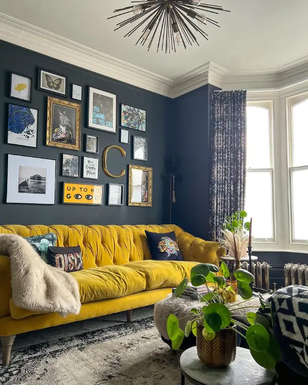 dark blue living room with yellow sofa - farrow and ball railings