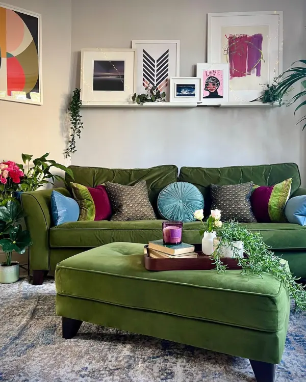 grey living room walls with velvet green sofa